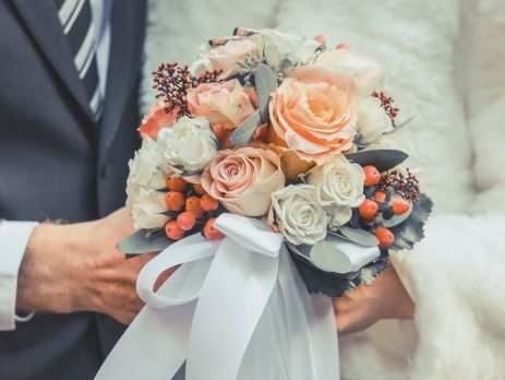 Bride and Groom holding flowers